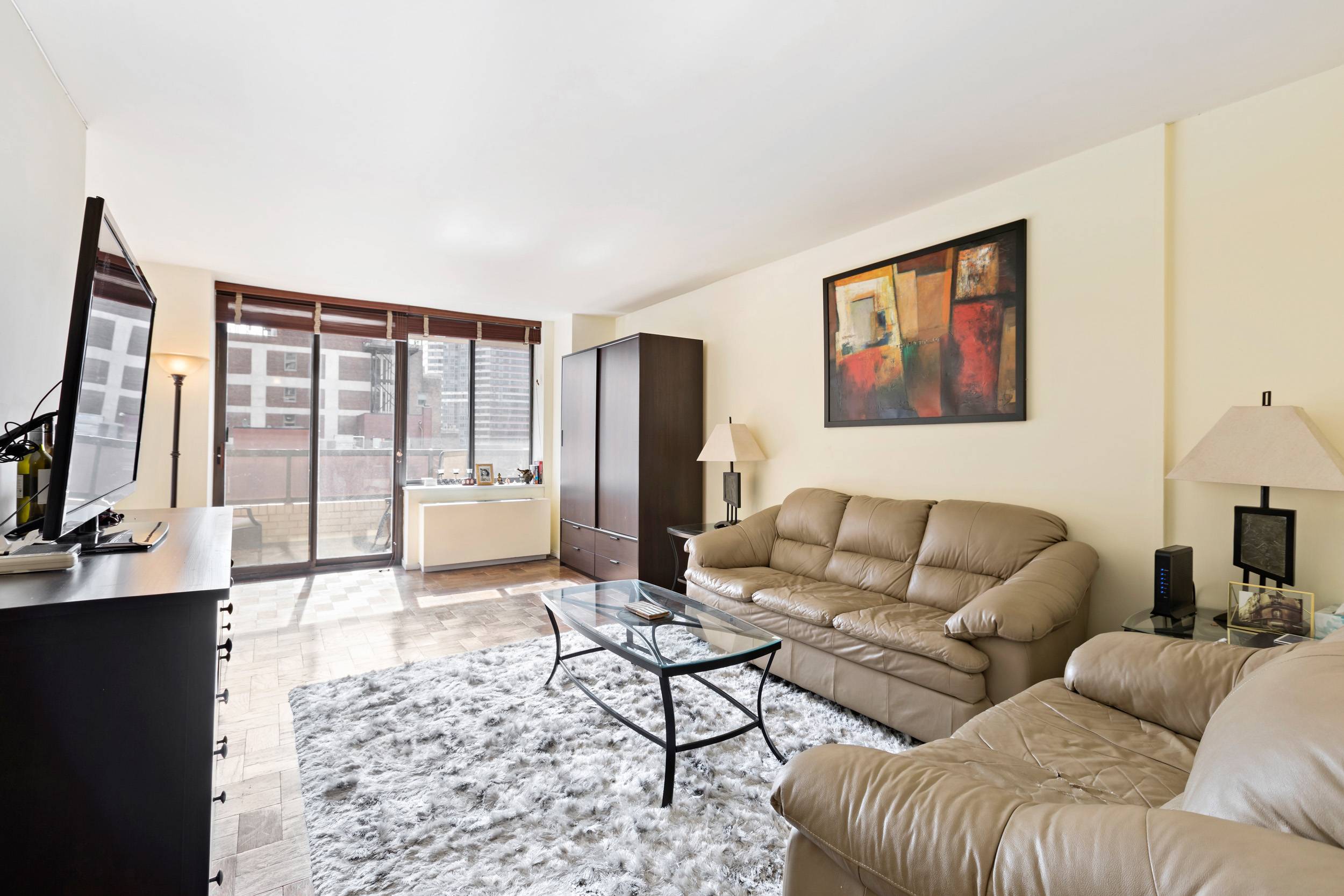 Murray Hill Sunny Alcove Studio With Terrace at The Whitney Full-Service Condominium East River Views!