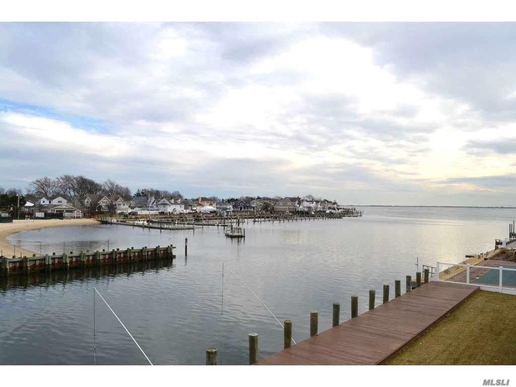 This Magnificent Biltmore Shores Waterfront Home Is Steps To The Open Bay.
