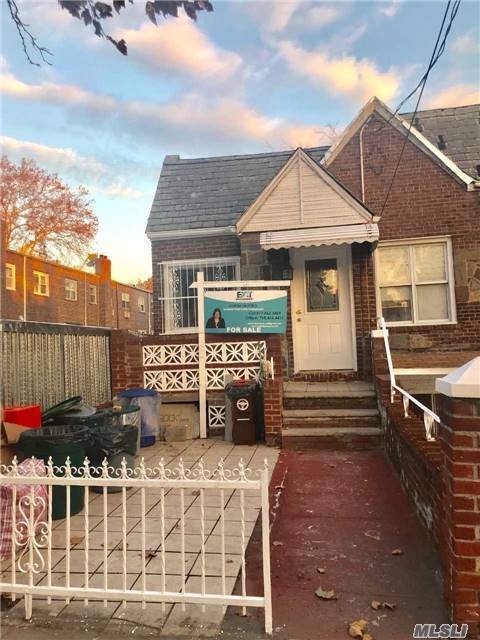 Large Brick Two Family In Woodside, Bordering With Maspeth.
