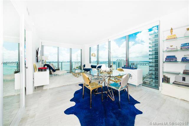 Enjoy sunrise and sunset views from this high floor upgraded corner unit at Icon Bay