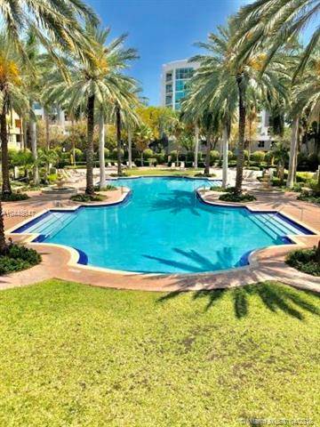 SPACIOUS 3/2 IN A MEDITERRANEAN STYLE RESORT IN THE COVETED SOUTH OF FIFTH NEIGHBORHOOD THAT FEATURES 2 POOLS