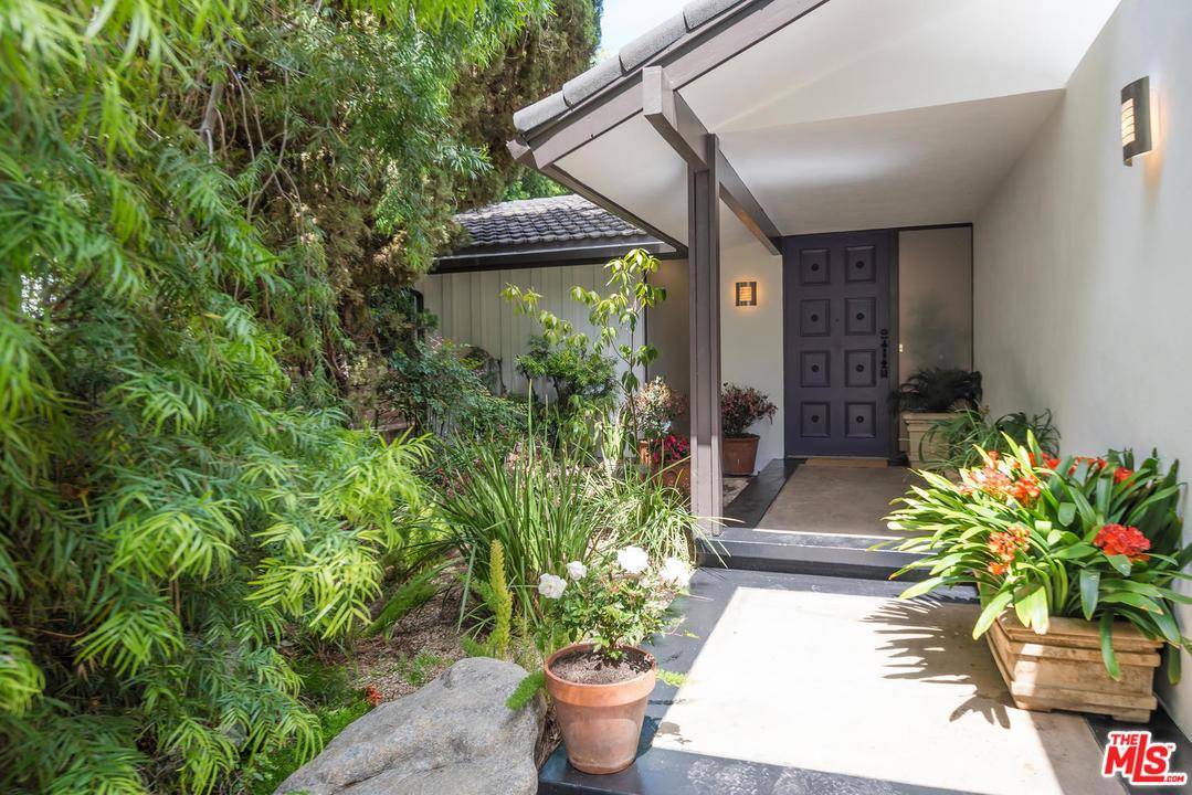 Elegant & beautifully updated post mid-century home designed by architect George C