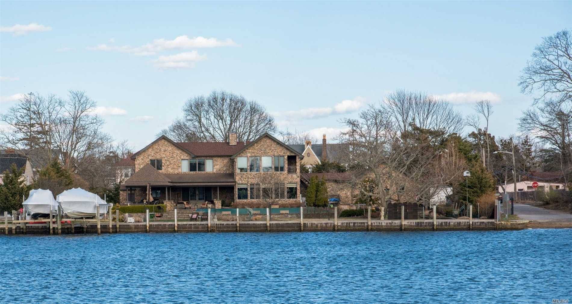 This Magnificent Water Front Home Is Perfect For Any Boater!