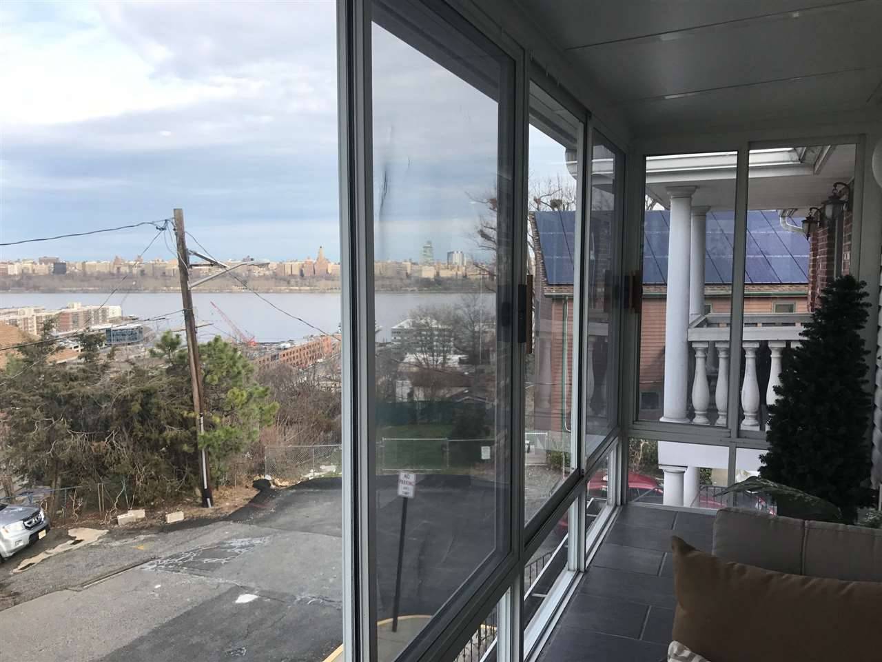 Enjoy a partial view of New York and Hudson River from second floor sunroom