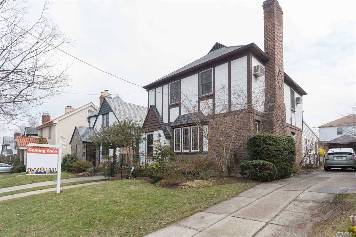 This Sparkling Tudor Features Woodwork, Formal Dining Room, Large Living Room With Firestone & Wood Burning Fireplace.