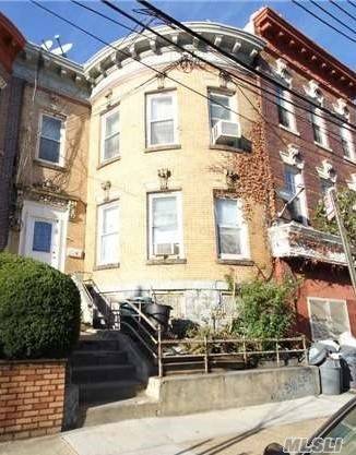Attached 2-Family Solid Brick Townhouse Featuring 11 Rooms, 5 Bedrooms, 2 Full Baths And Full Basement.