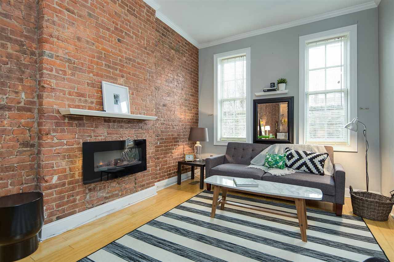Welcome home to this beautifully updated 1BD + Den / 1BA duplex