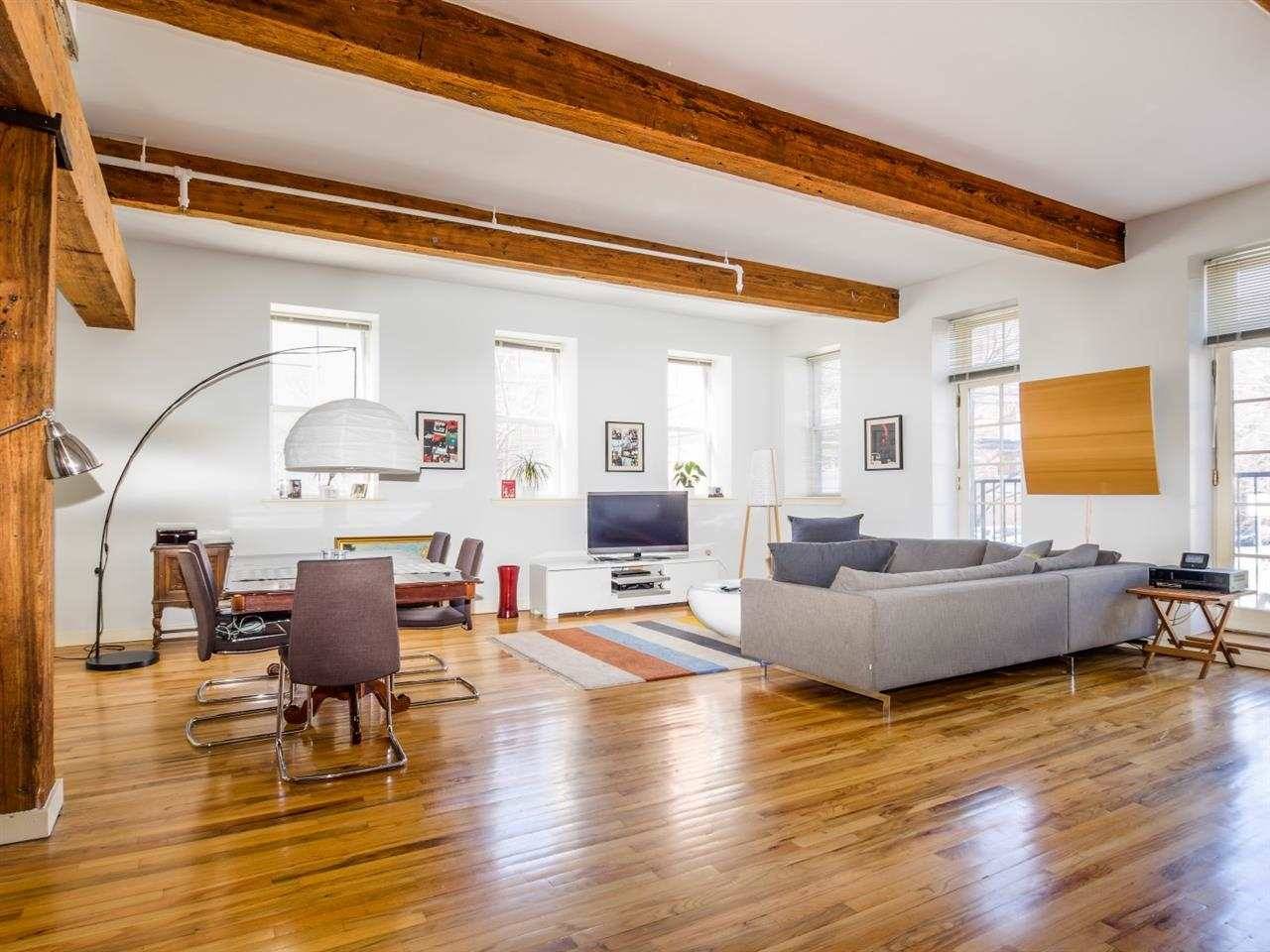 Amazing loft space in this 2br/2ba corner unit with one garage parking space