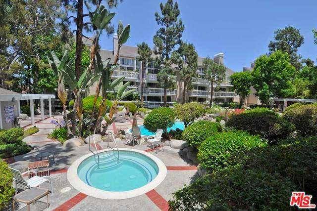 THIS IS A LOVELY REMODELED UNIT THAT FACES A WATERFALL IN ONE OF THE MOST BEAUTIFUL COMPLEXES IN THE MARINA