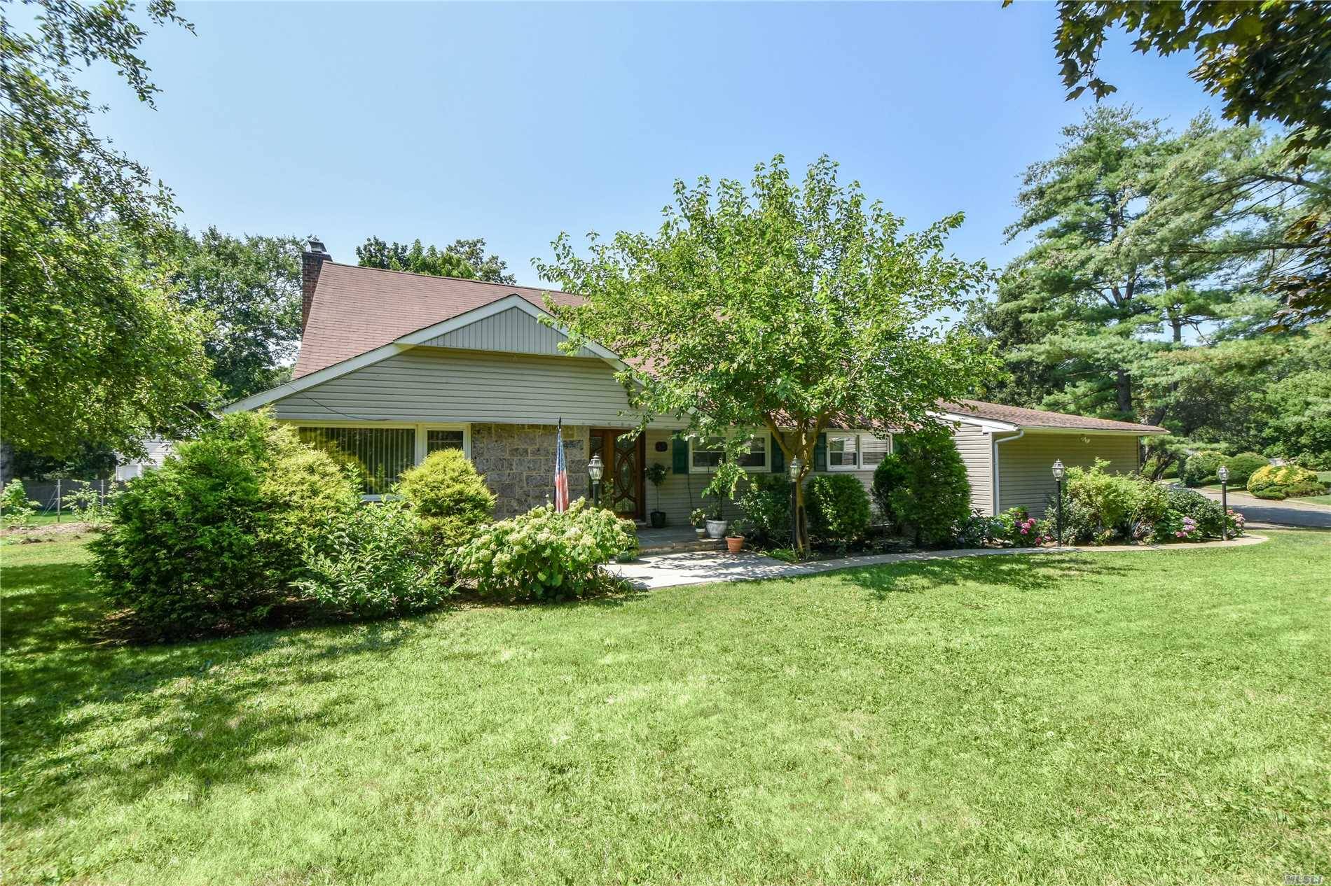 Nestled On 1/2 Acre Of Lush Property This Diamond Home Is Picture Perfect Inside & Out!