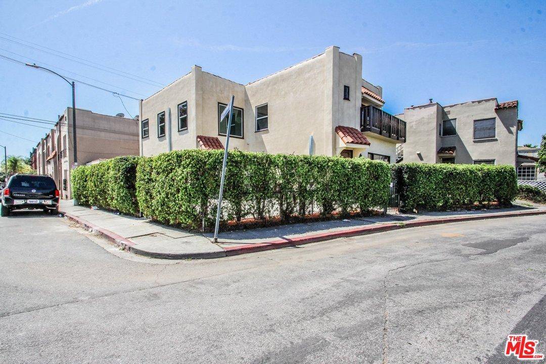 Gorgeous Spanish Style triplex situated in Hollywood is the perfect rare investment