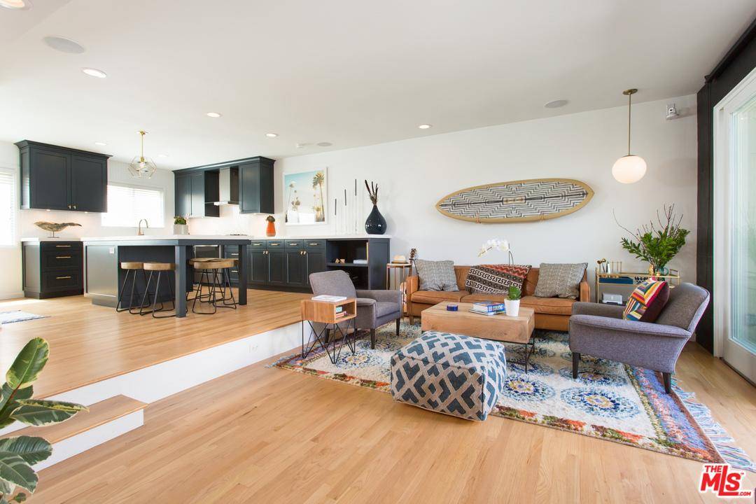 Welcome home to this beach-chic tri-level Ocean Park townhouse