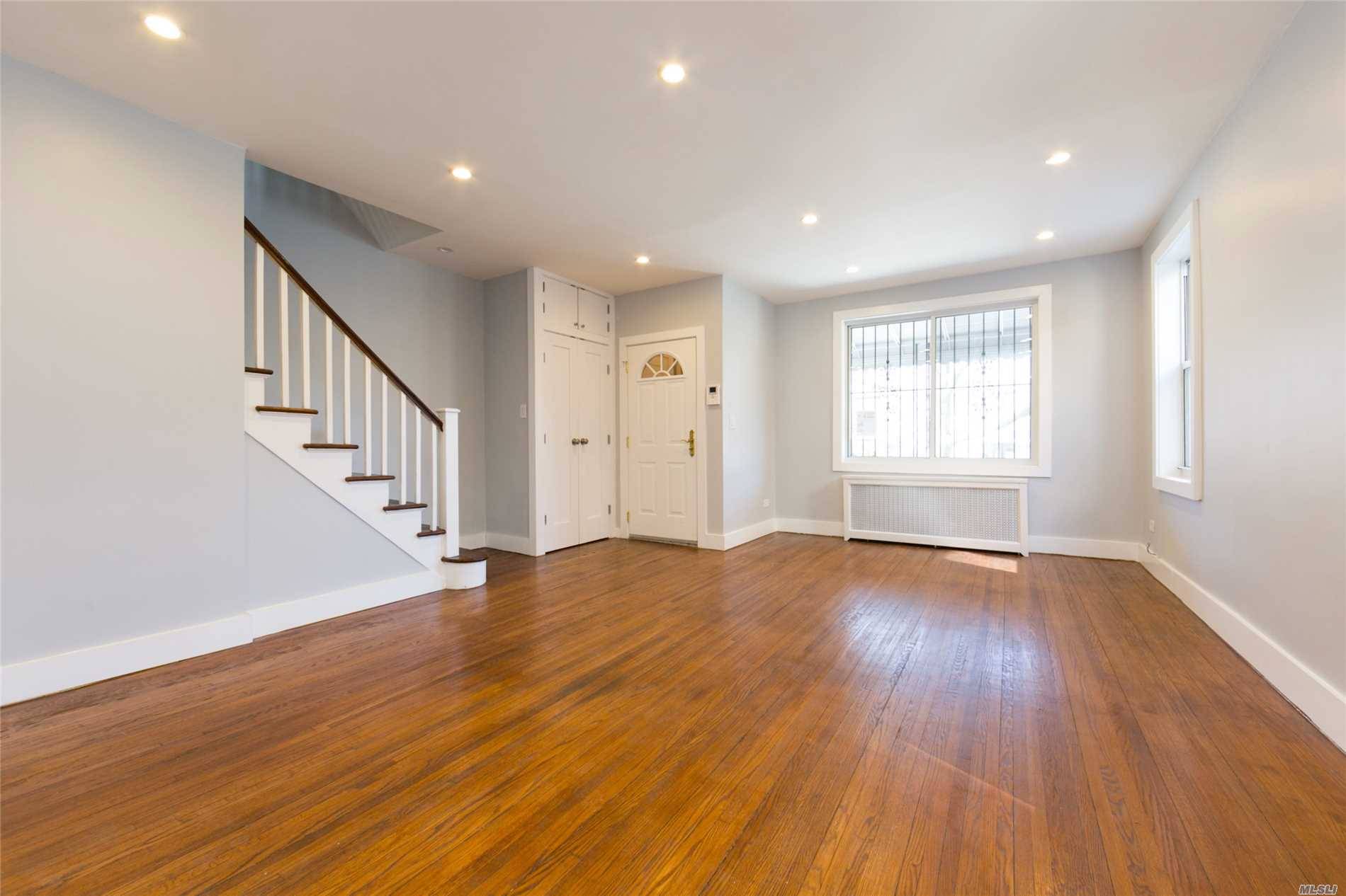 Luxuriously Renovated Move In Ready Brick Two Family Townhouse Nestled On A Beautiful Tree Lined Street Of Forest Hills.