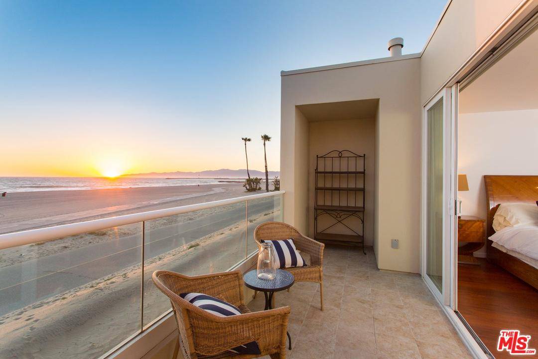 Enjoy unobstructed ocean views from this sunny newer construction two story town-home just steps from the sand in the Breakers complex