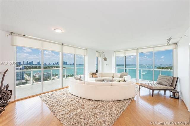 Expansive views of the bay and downtown skyline greet you as you enter this rarely available corner apartment