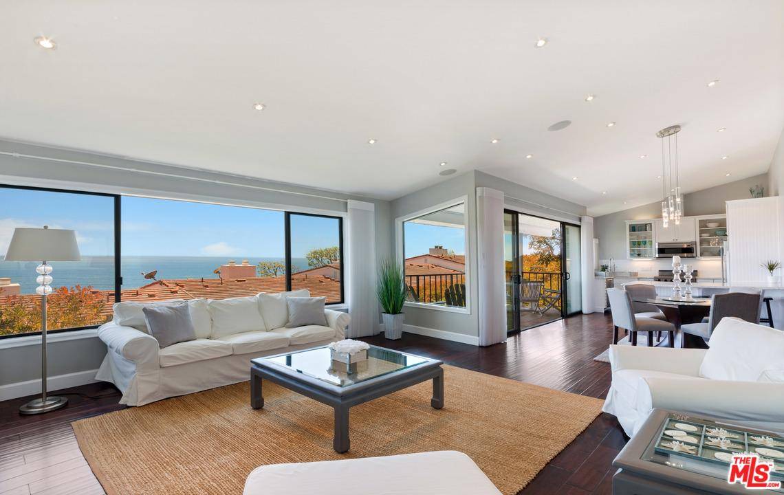Turnkey property located in Zuma Bay Villas with ocean views from living room