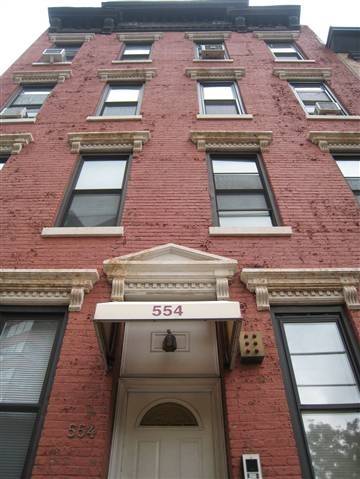 This is a 1BR/1BA with exposed brick in the living and bed room