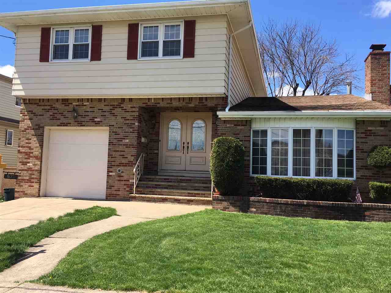 Welcome to this Custom Built Home in the Clarendon Section of Secaucus with approx