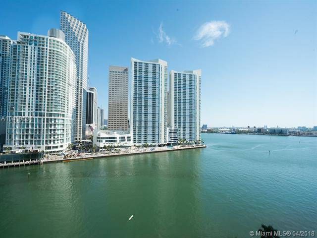 Beautiful 2 bedroom corner unit with full floor to ceiling windows over looking the mouth of the Miami River and the Port of Miami