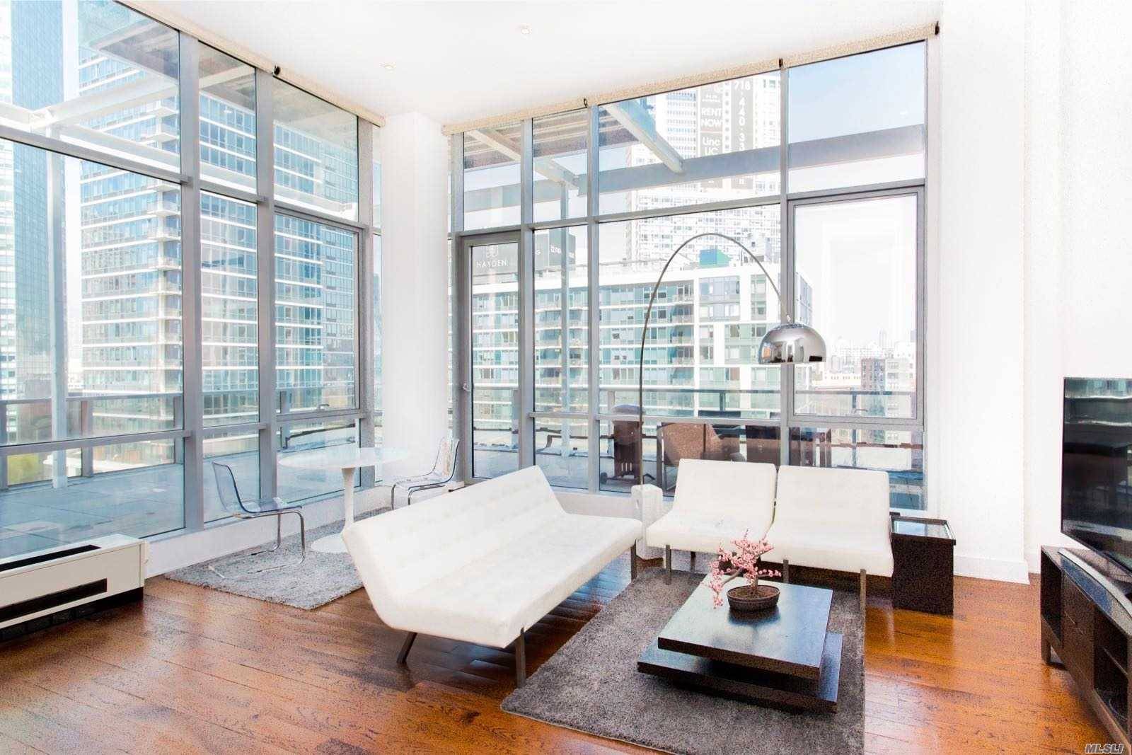 This Luxurious Penthouse Located In An Up And Coming Part Of Lic Featured With A 1000Sf Wrap Around.