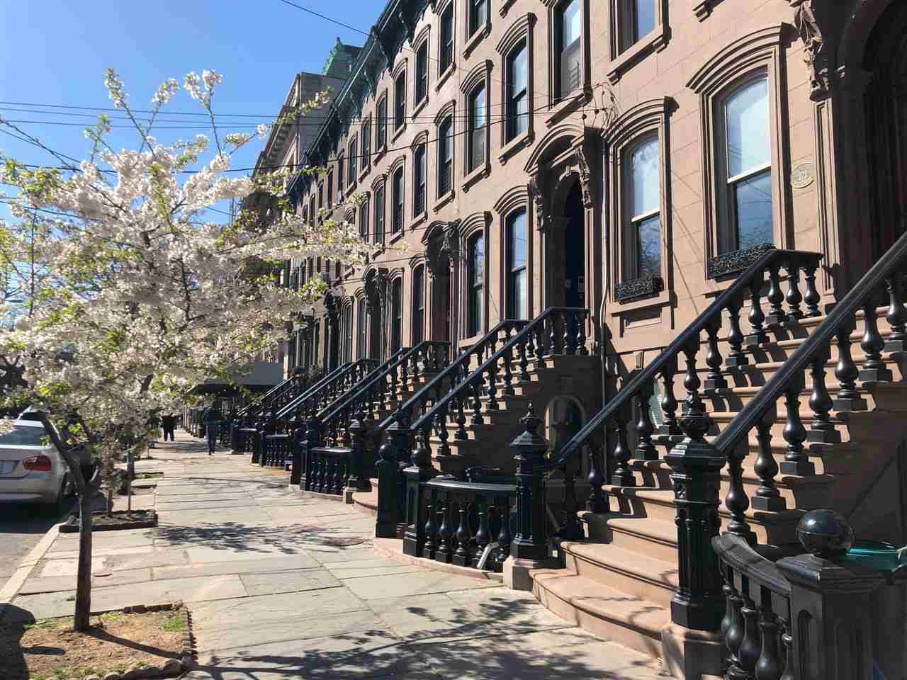Live directly on Beautiful Van Vorst Park in a true Historic “19th Century” Brownstone