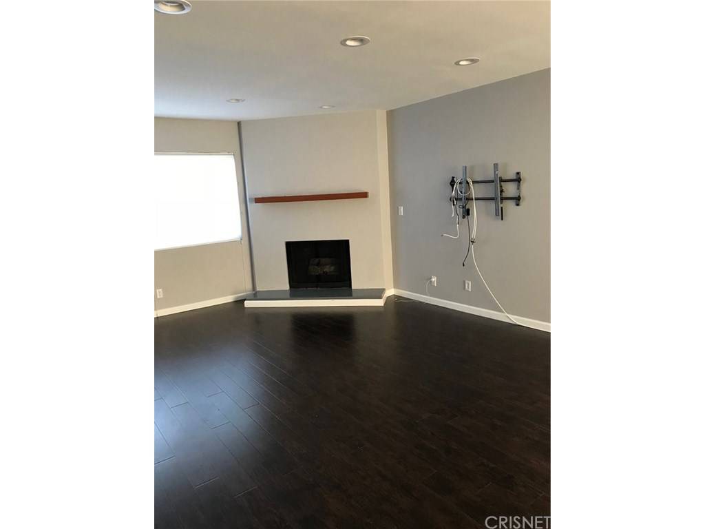 Reduced and Ready to move into this 2 BR townhome with high quality flooring and recently updated kitchen