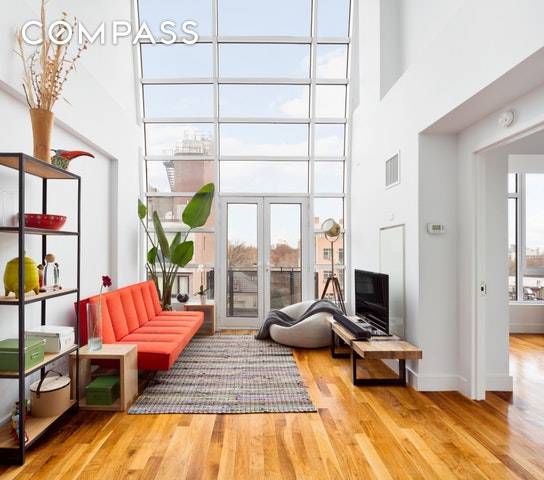 Set in a modern condo building near McCarren Park, this spacious duplex apartment spans 1, 214 square feet and features 2 bedrooms, 2 full baths, a double height living room ...