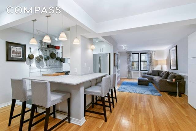 Exquisitely renovated converted 2 bedroom, 1 bath in the ideal Upper East Side location.