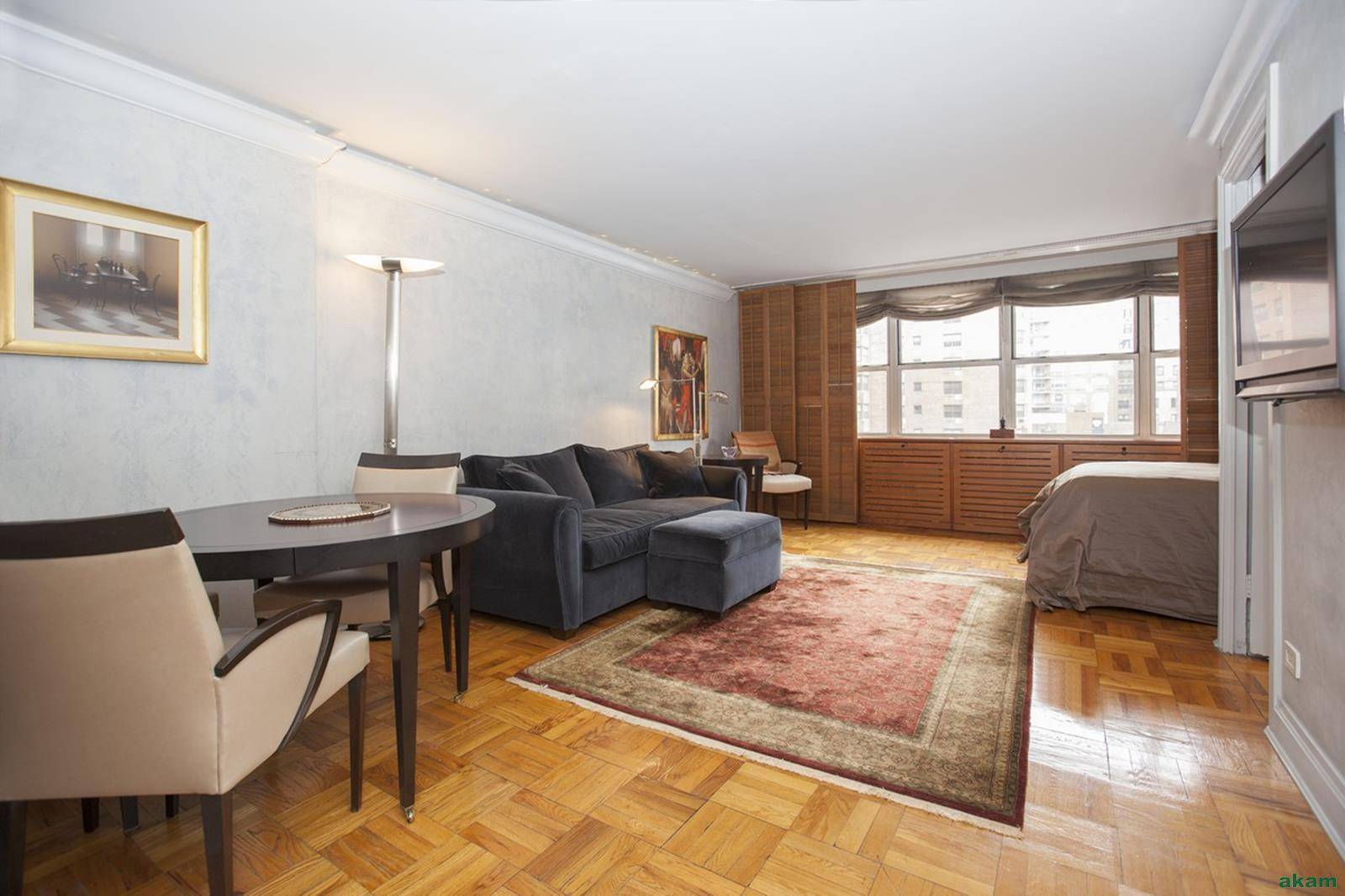 Tastefully renovated this spacious and light alcove studio offers an art deco kitchen with marble floor, granite counters with a stylish tin back splash and glass cabinets.