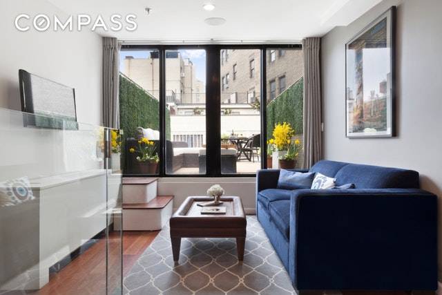 This beautiful two bedroom with large private terrace is on the penthouse level of the historic Cast Iron Building on one of the very best blocks in Greenwich Village.