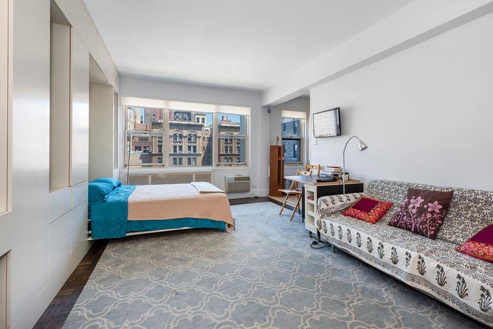Sun filled large studio apartment in the highly sought after Peter Warren building at 45 West 10th Street.