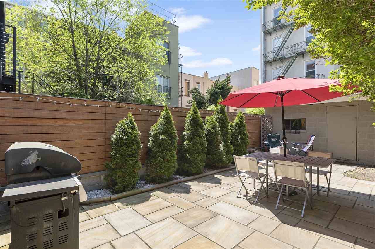 Wonderful opportunity to own a spacious 1 bedroom condo with a private backyard oasis on highly desirable Garden St