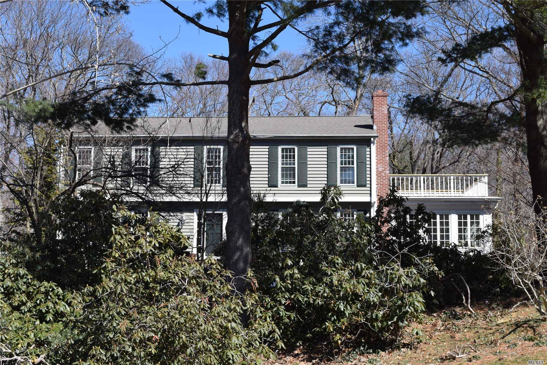 Spacious Colonial Nestled On Delightful, Secluded Wooded Property.