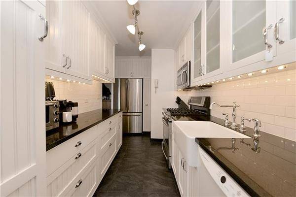 This two bedroom convertible 3rd bedroom home has a renovated kitchen, beadboard white cabinets, farm sink, subway tile backsplash, stainless steel appliances, dishwasher, wood floors, plenty of closets and a ...