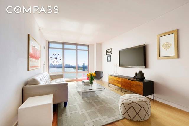 24C is a 775sf 1 bedroom, 1 bath offering open views of the East River, the Williamsburg Bridge and the downtown Manhattan skyline.