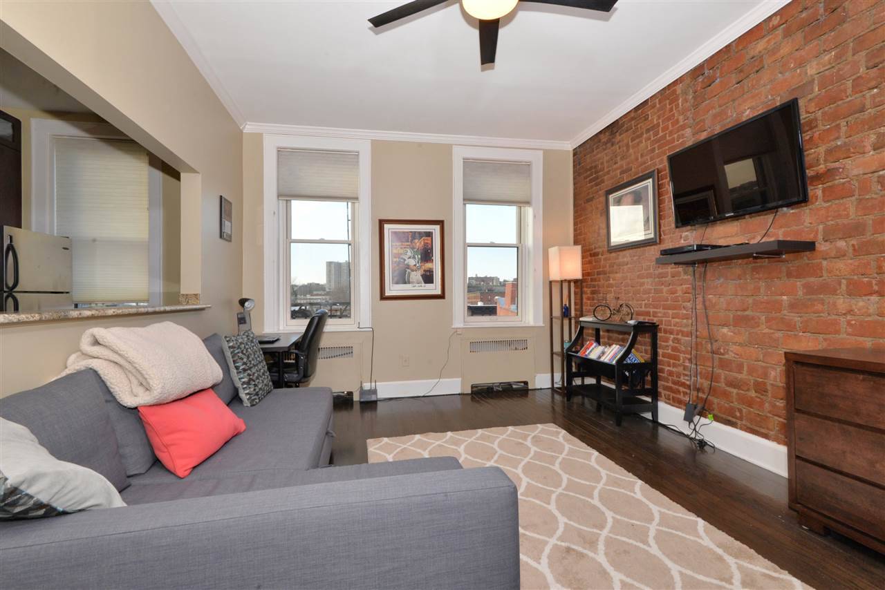 Located in prime uptown Hoboken is this immaculately kept expanded studio with hidden separate sleeping area & exceptional open layout