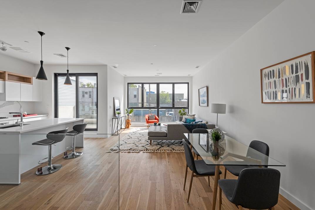 A brand new triplex condo that feels like a modern Brooklyn townhouse, this 2 bedroom, 2 bathroom home blends a collection of chic finishes and fixtures with private outdoor space.
