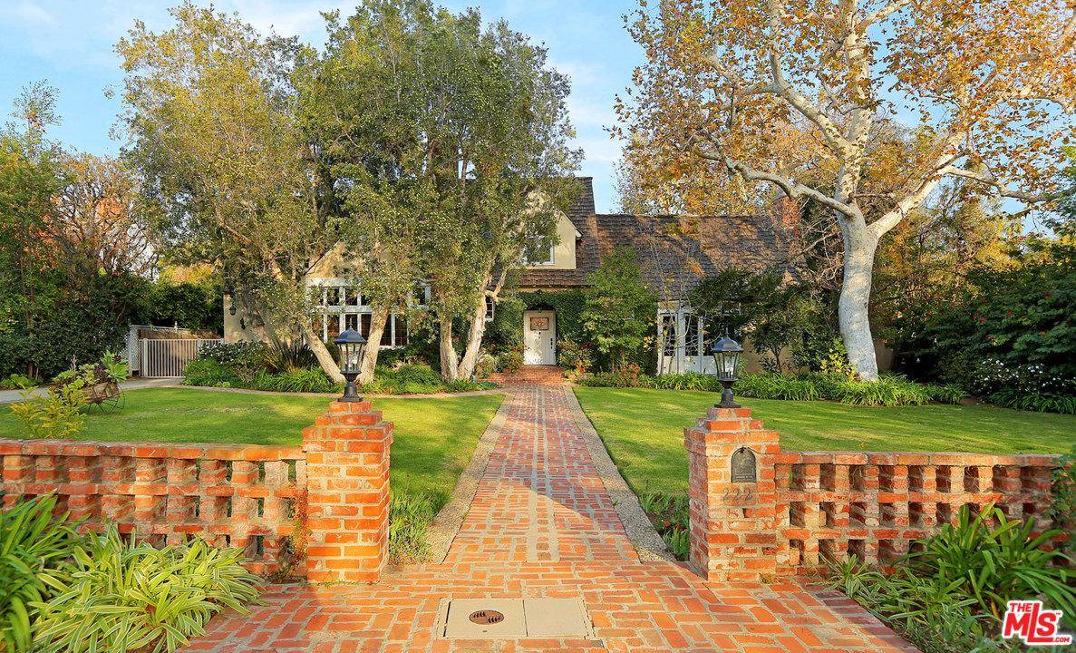 Revel in the grandeur and charm of this lovely country home -- located on a sizable lot in LA's exclusive Brentwood Park