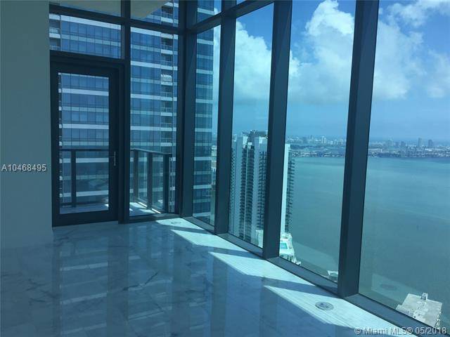 Enjoy this stunning Lower Penthouse residence with breathtaking & unobstructed Biscayne Bay & Atlantic Ocean views with 3 bedroom + Den + 3