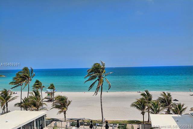 Amidst the soft white sand and calm turquoise waters of Hollywood Beach