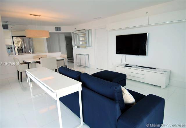 Fully upgraded and furnished 2 bedroom corner unit at Yacht Club at Portofino