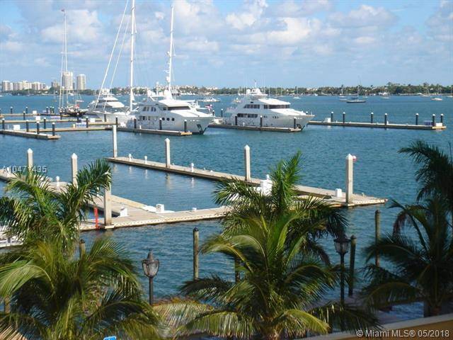 GREAT VALUE FOR SPACIOUS CONDO WITH PANORAMIC WATER VIEWS AND DOCK