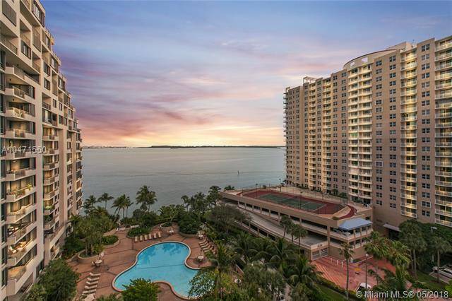 Live in one of the largest 2 bedroom units in Brickell Key with direct bay and city views