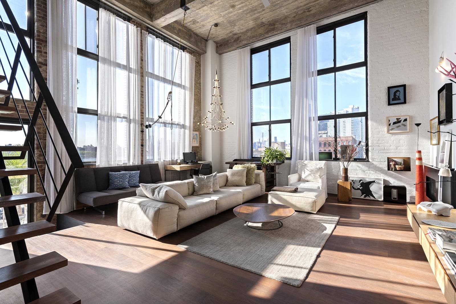 A chic designer loft overlooking the East River, this one of a kind 4 bedroom, 2 bathroom corner loft brushes an eclectic palette of warm, organic textures upon a prewar ...