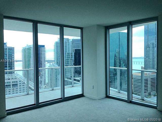 OUTSTANDING 2 BEDROOM 2 BATH CORNER UNIT IN MILLECENTO BY PININFARINA FACING SE WITH GREAT OPEN VIEWS OF TOWN AND BAY