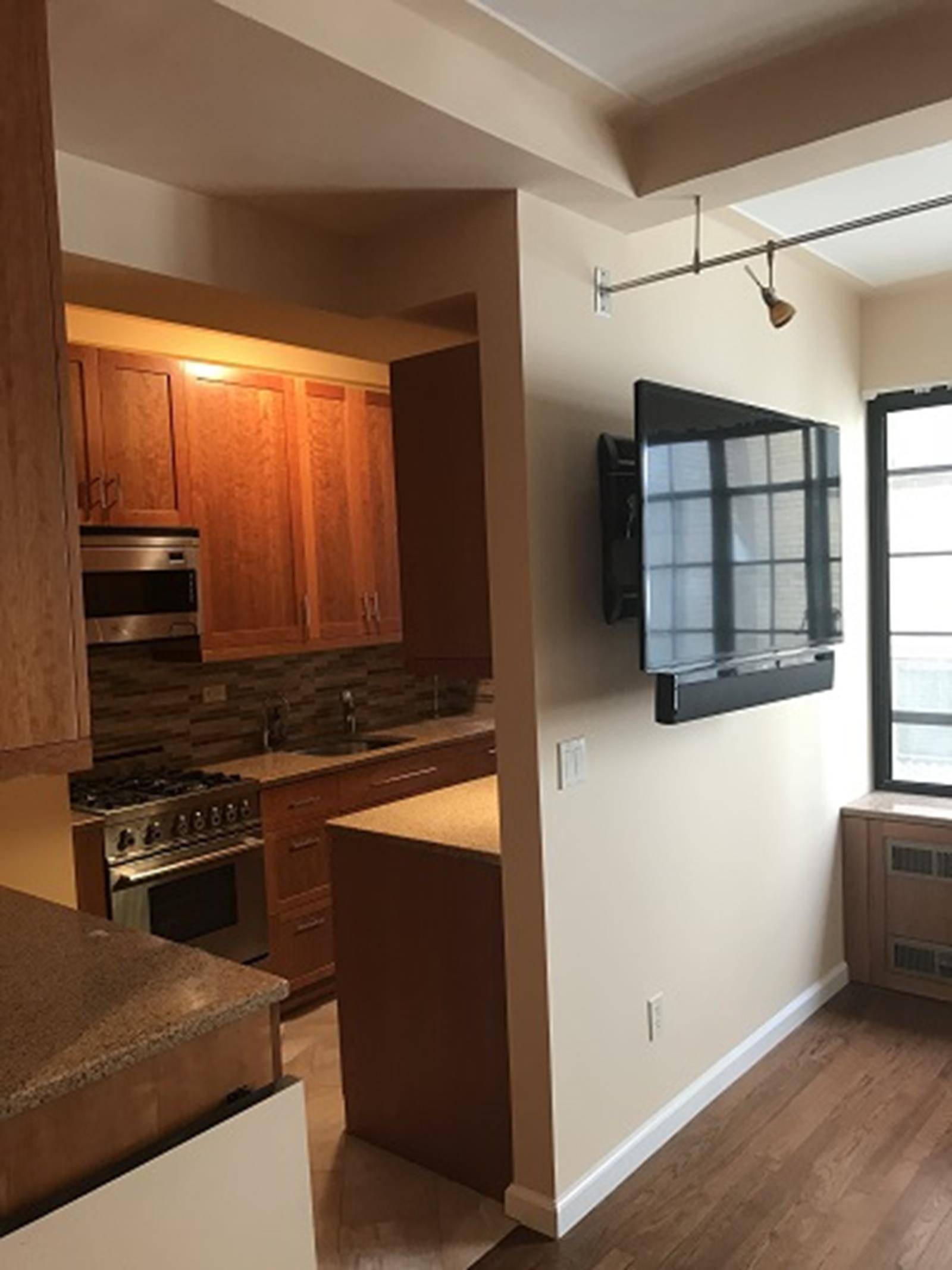 This beautifully renovated extra large studio, has a windowed chef's kitchen, with an abundance of both cabinets and counter space, a wine cooler plus a dishwasher.