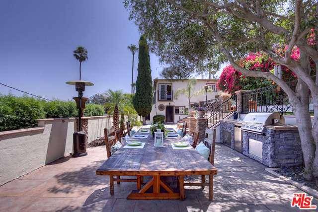 This exceptional Mediterranean villa is situated on an expansive lot with stunning mountain and city views high atop Playa Del Rey