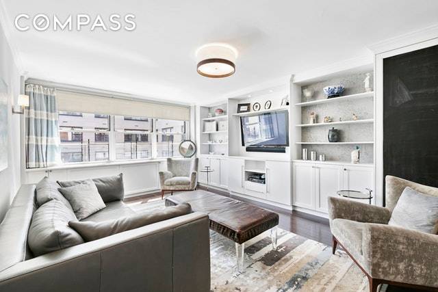 This expansive, top floor three bedroom, two bathroom home is a modern Lenox Hill showplace featuring impeccable renovations, top notch appliances and fine finishes in a full service postwar co ...