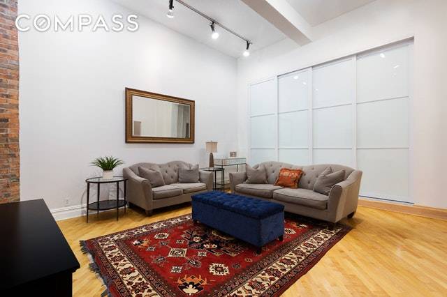 Spacious, sophisticated and serene loft with soaring 12'9 ceilings in the heart of Murray Hill.