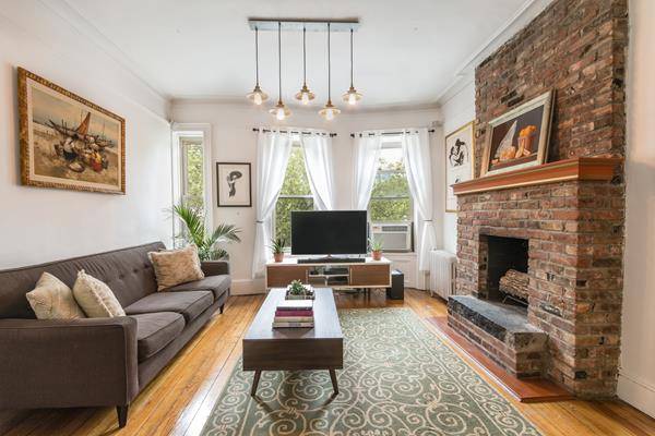 Lovely spacious sunny one bedroom with home office and wood burning fireplace on prime Cobble Hill block in a cherished and well cared for pre war co op.